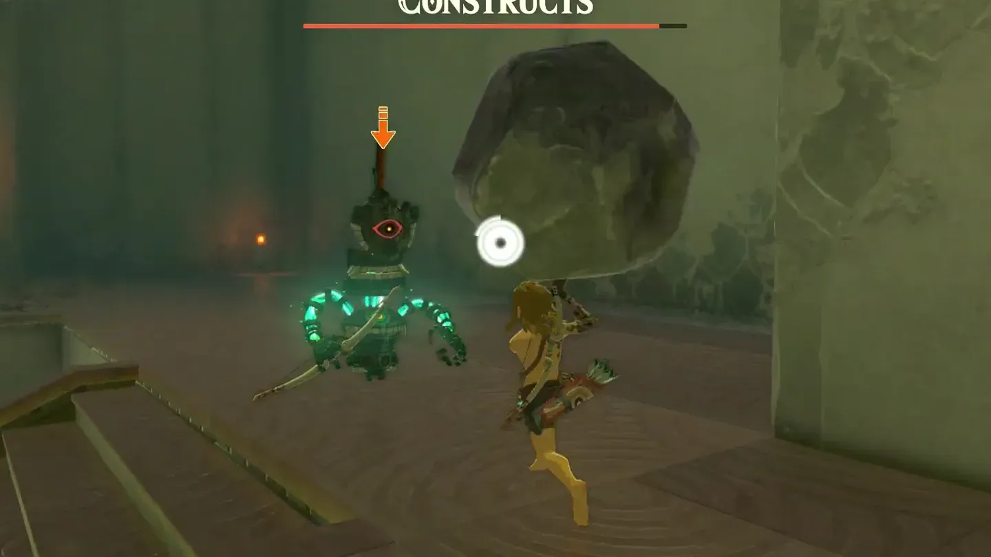 Link landing a hit on a Construct in a burst of sparks