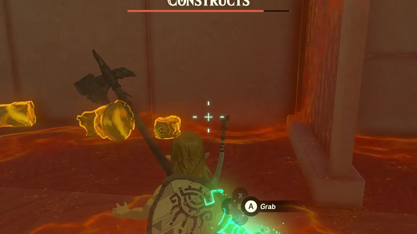 Link with Ultrahand ready next to the bomb barrels