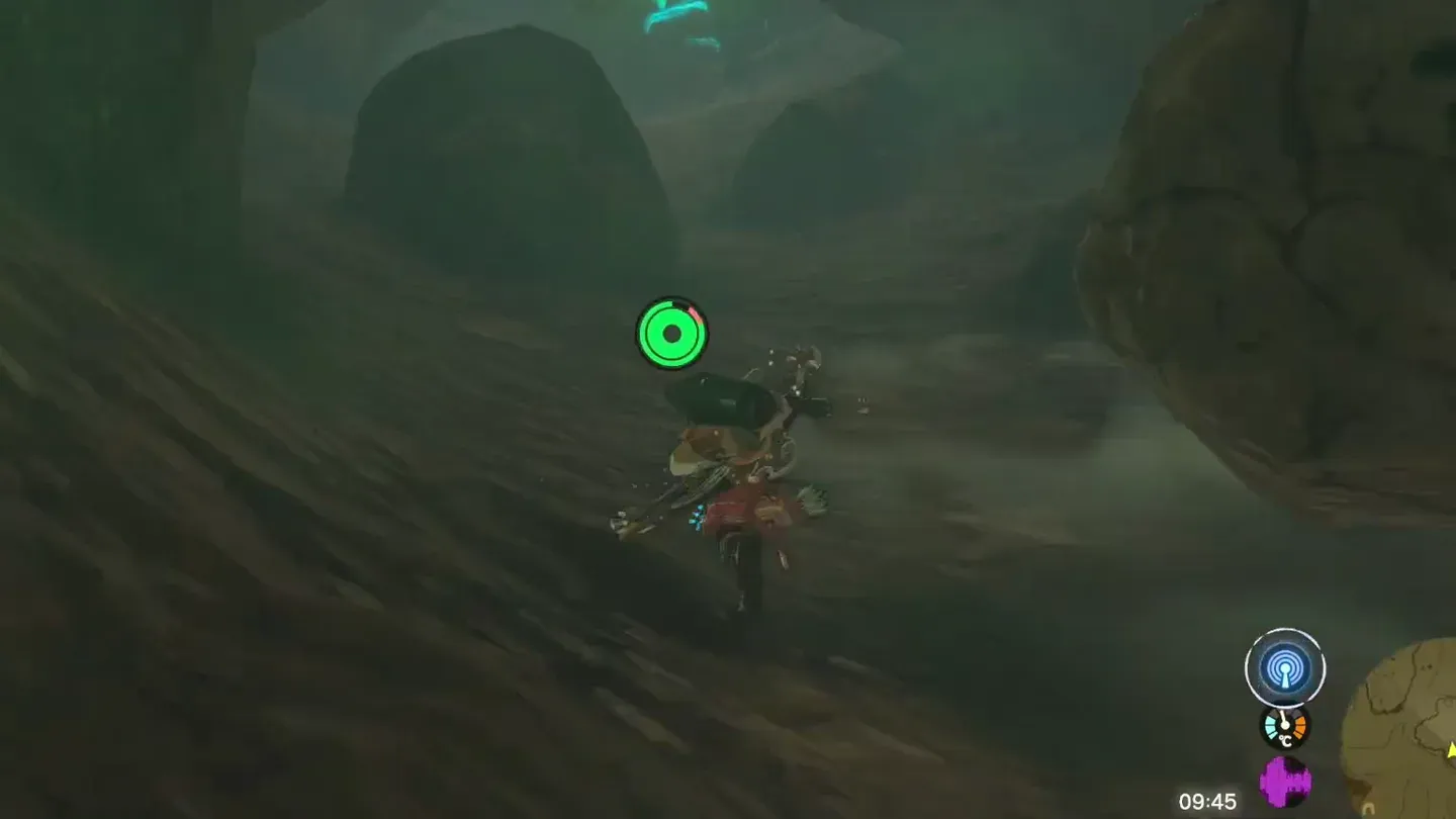 Link running up a dark rocky slope in the cave