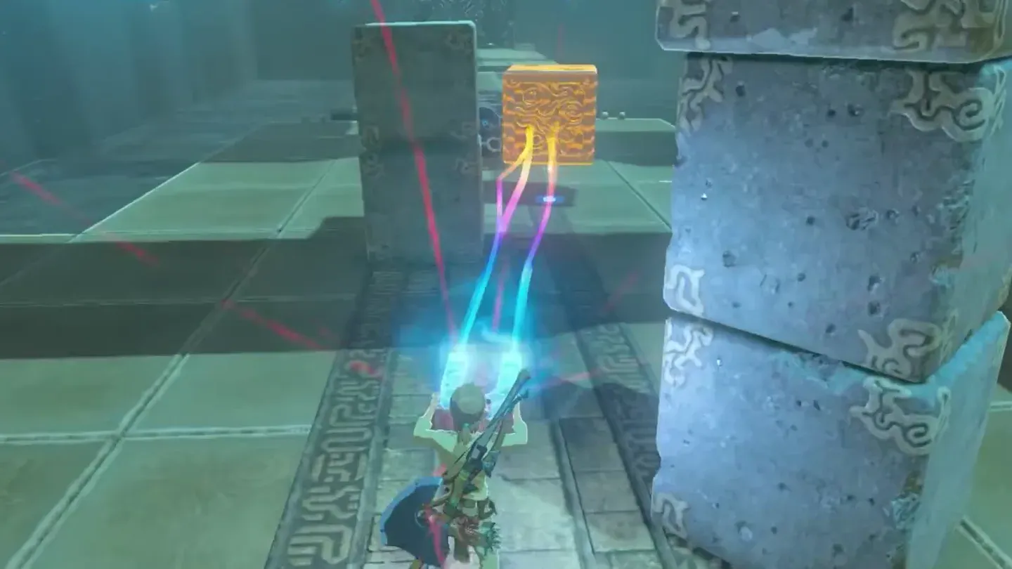 The metal cube swung against the stone blocks