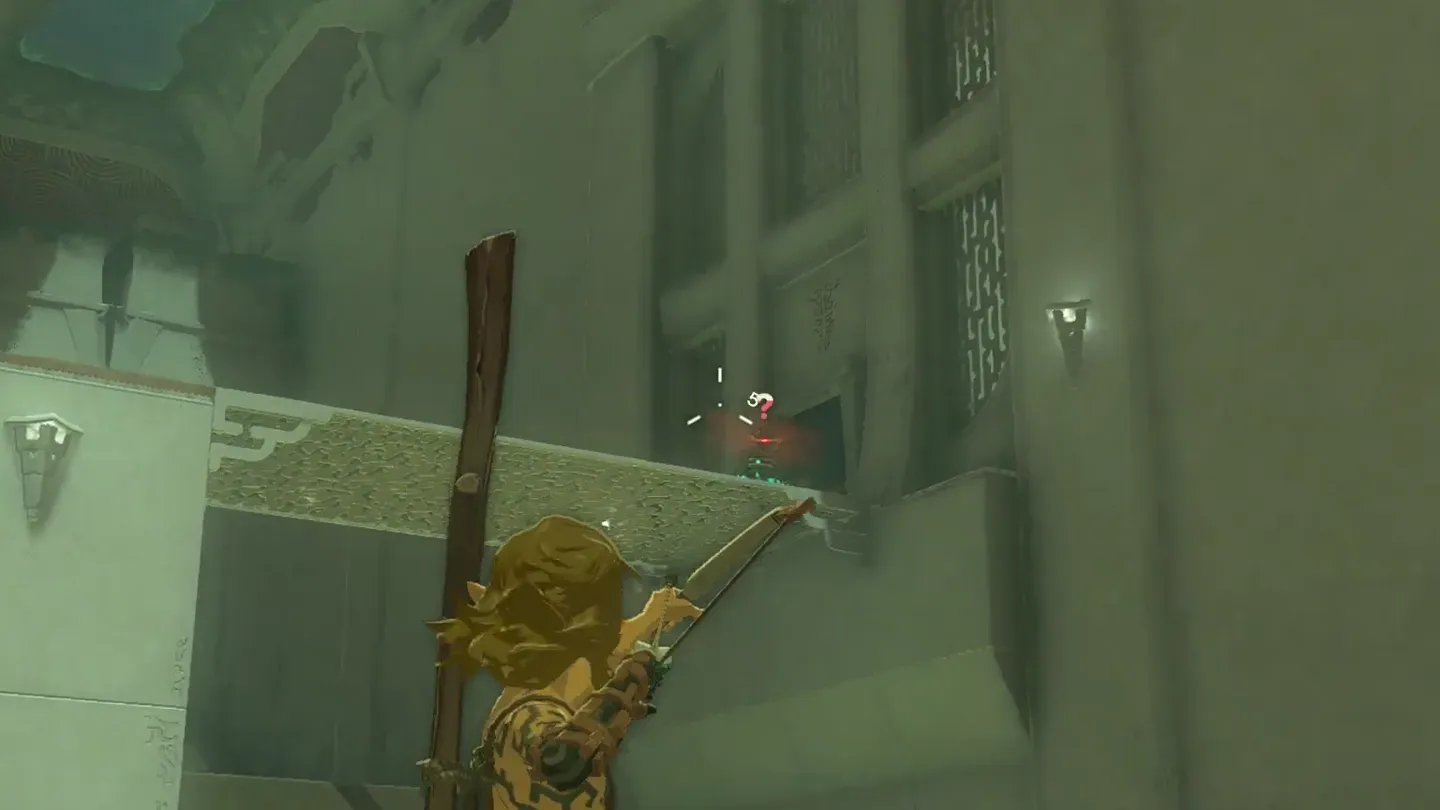 Link drawing his bow at a Construct on the ledge