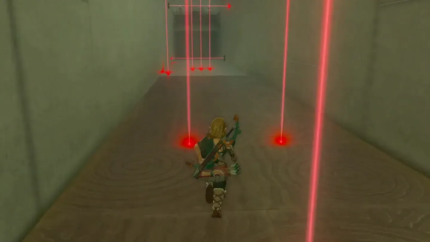 Link walking into a red laser beam