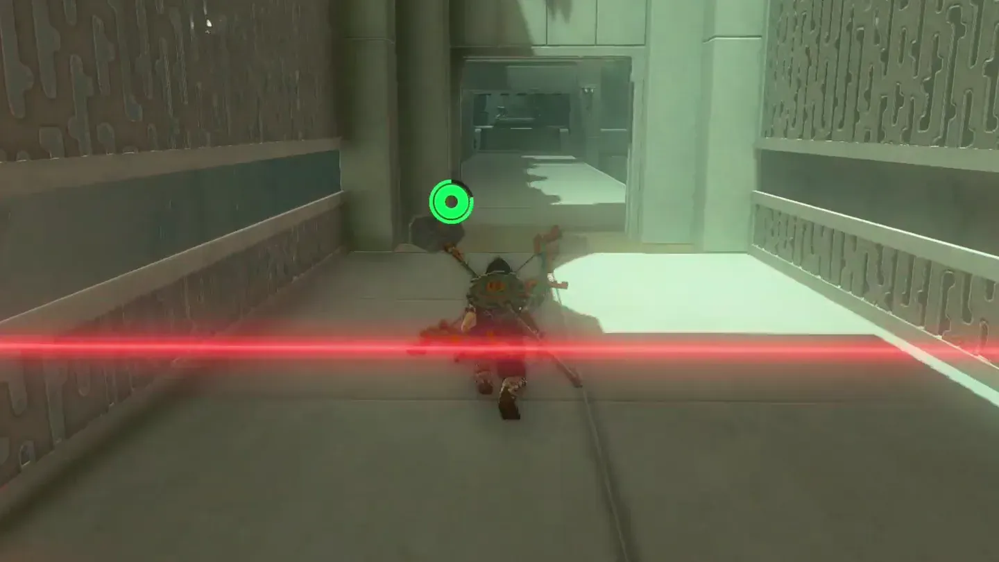 Link crouching as a sweeping laser passes over him