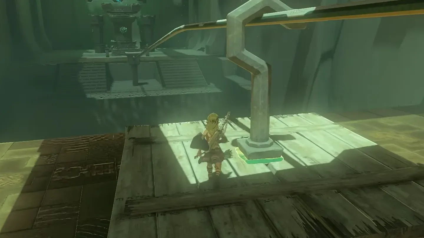 The board hanging from the zipline rail by its hook with Link on it