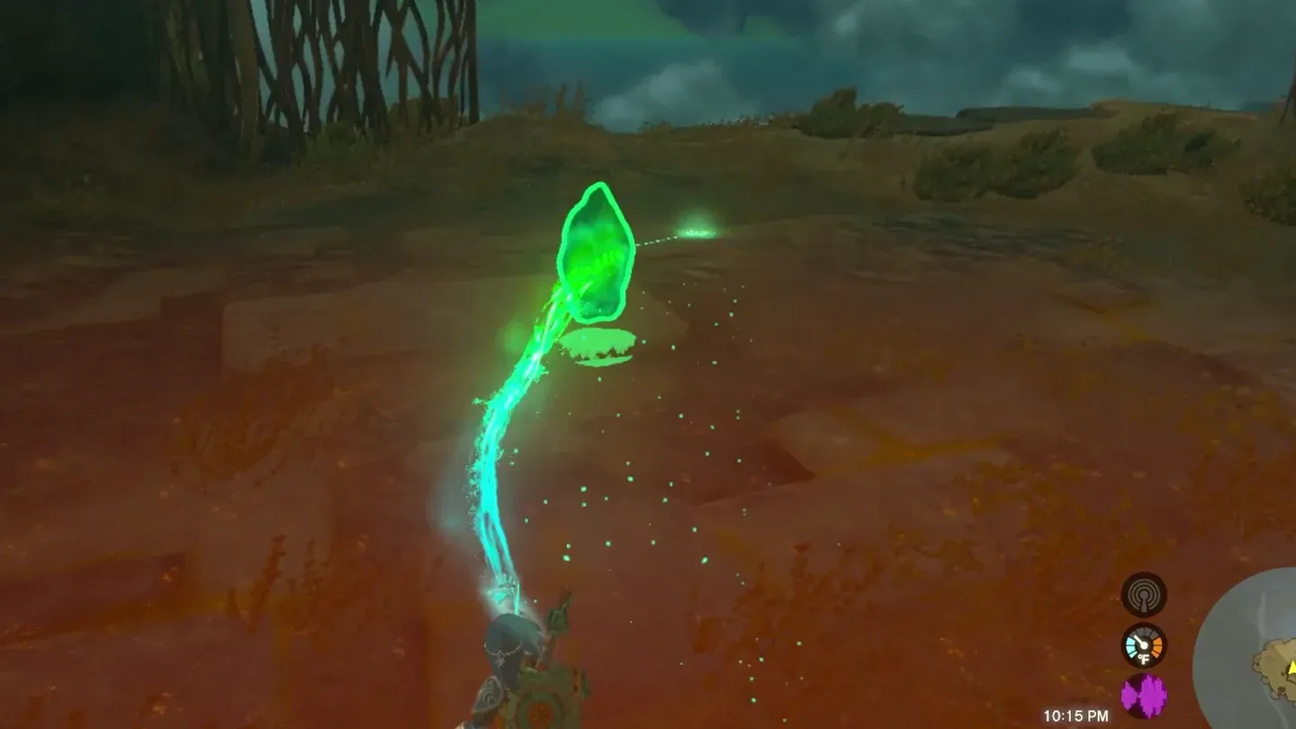 Ultrahand carrying the green crystal out of the cave