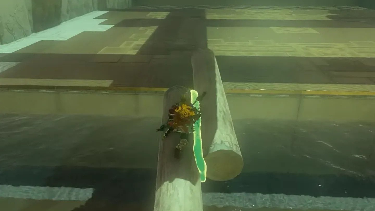 Link walking across the log bridge over the water