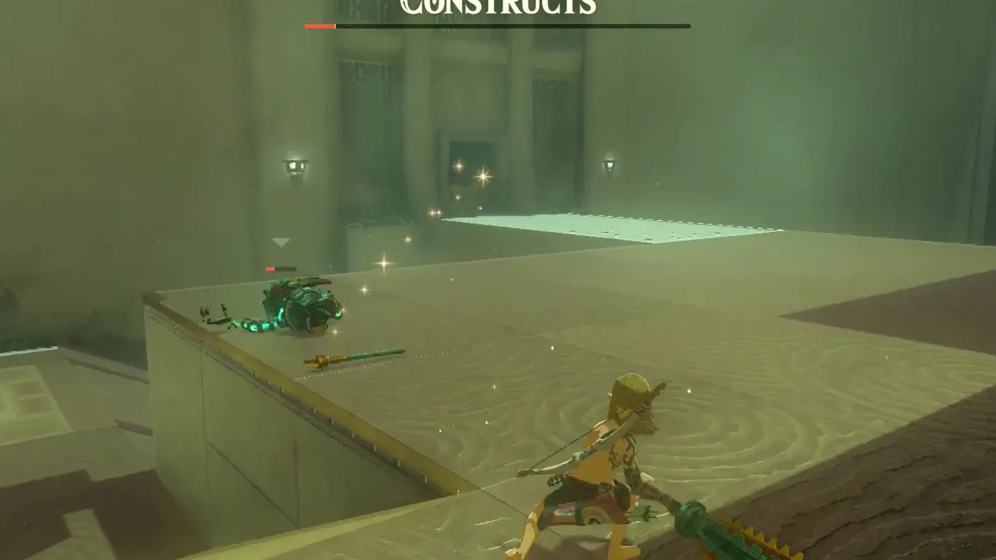 A Construct lying defeated with its weapons scattered