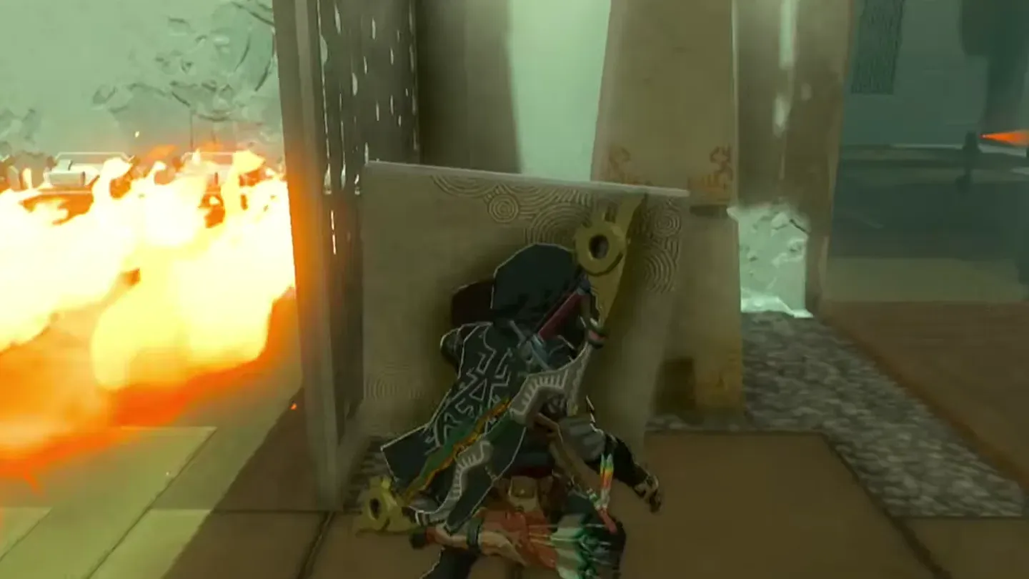 Link shielding himself with the stone slab while passing the flames