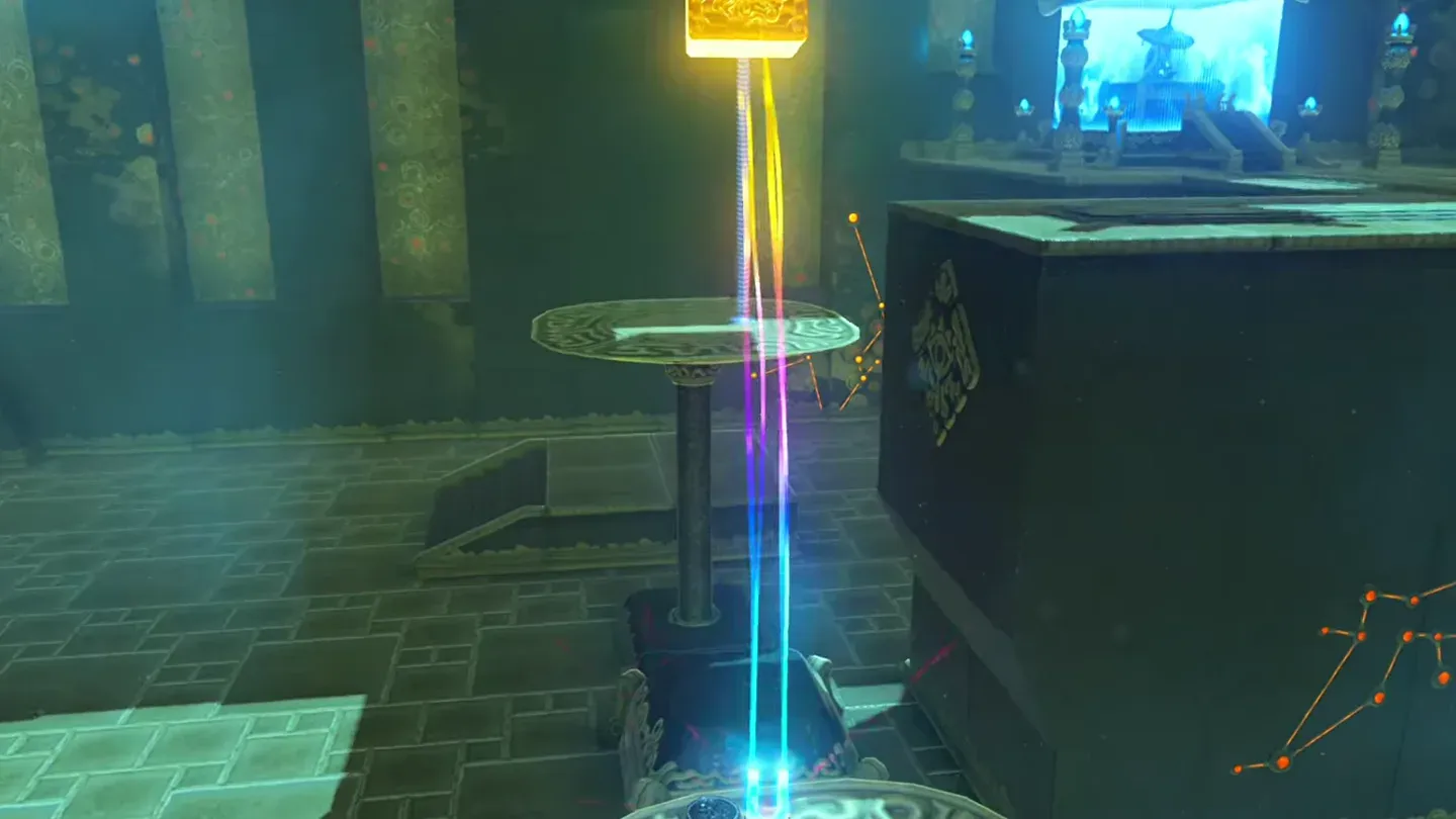 Link lifting the metal cube high above the scale