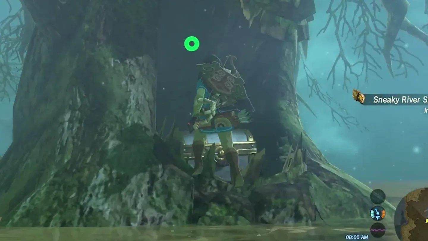 A metal treasure chest sitting in the mouth of another tree