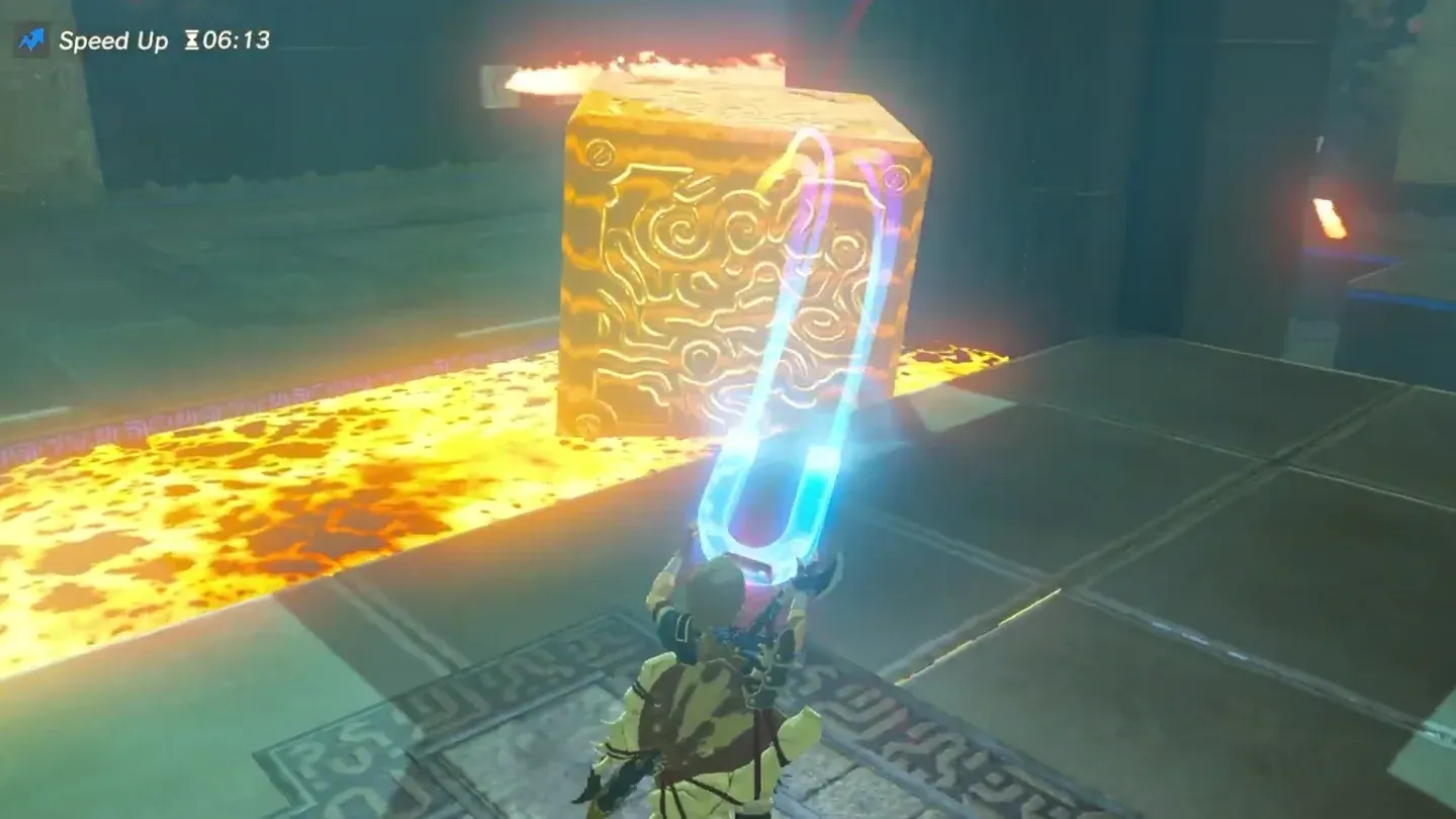 Link lifting the metal cube out of the lava with Magnesis
