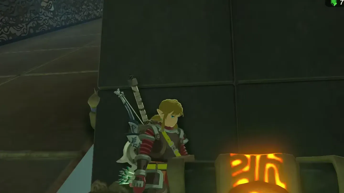 Link at a closed treasure chest on the wall platform