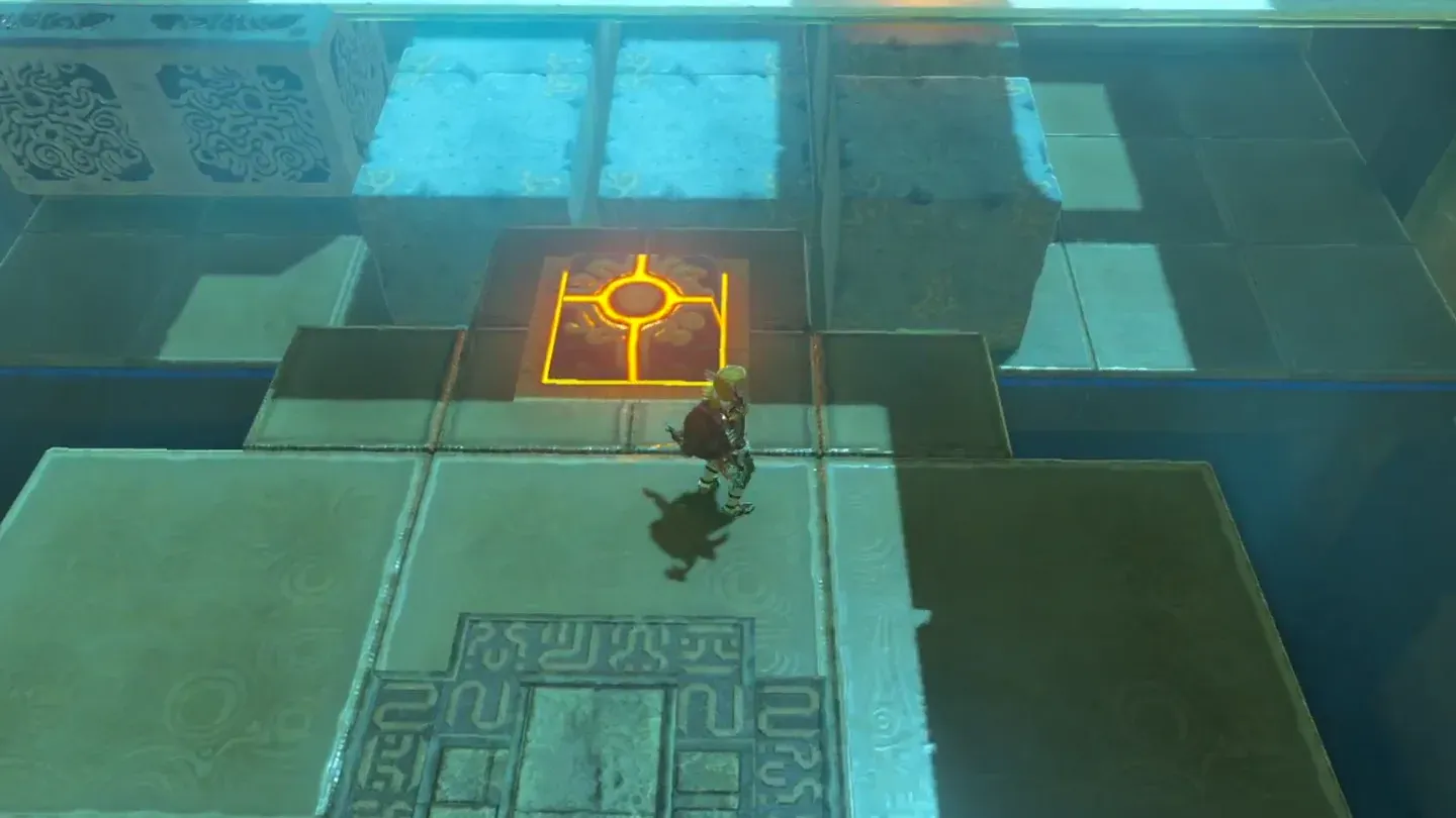 The floor switch in front of the row of stone blocks
