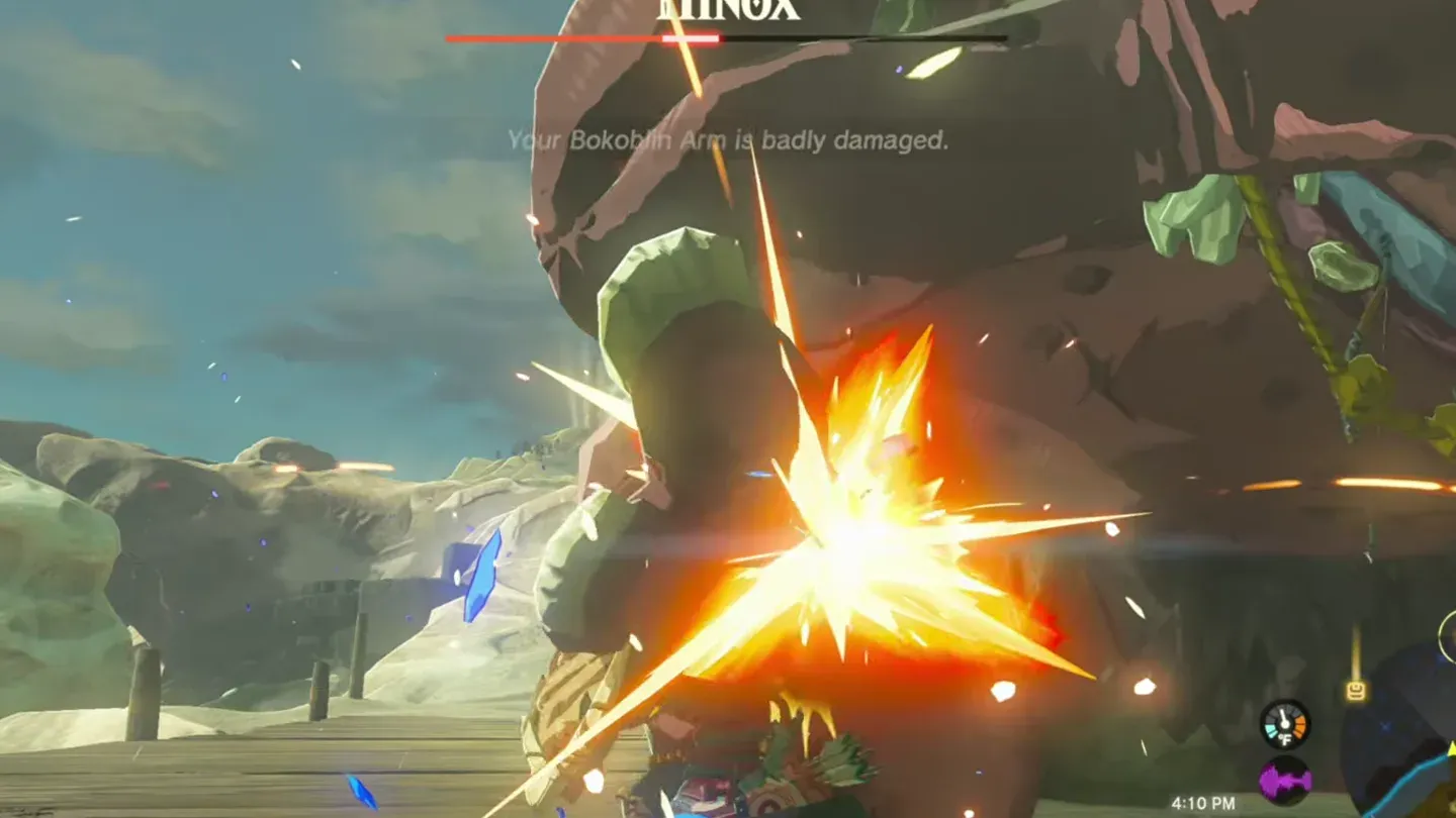 Link hitting a Hinox that lies on the ground