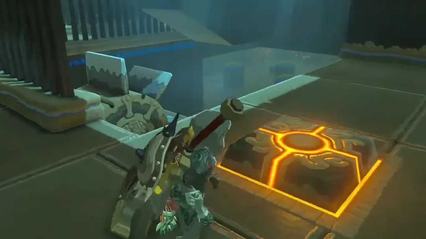 Link next to a floor switch near the large wheel