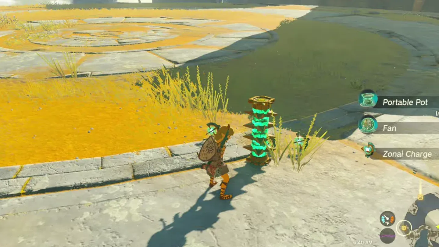 Link beside a Flux Construct core on the ground; pickup list shows Portable Pot, Fan and Zonai Charge