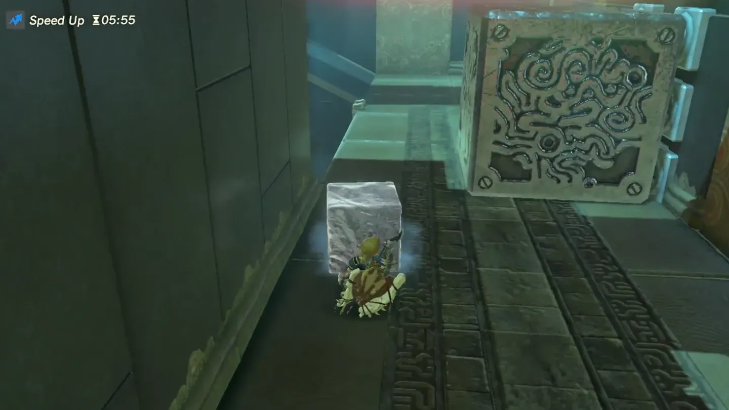 The metal cube blocking the jets while Link carries the ice past