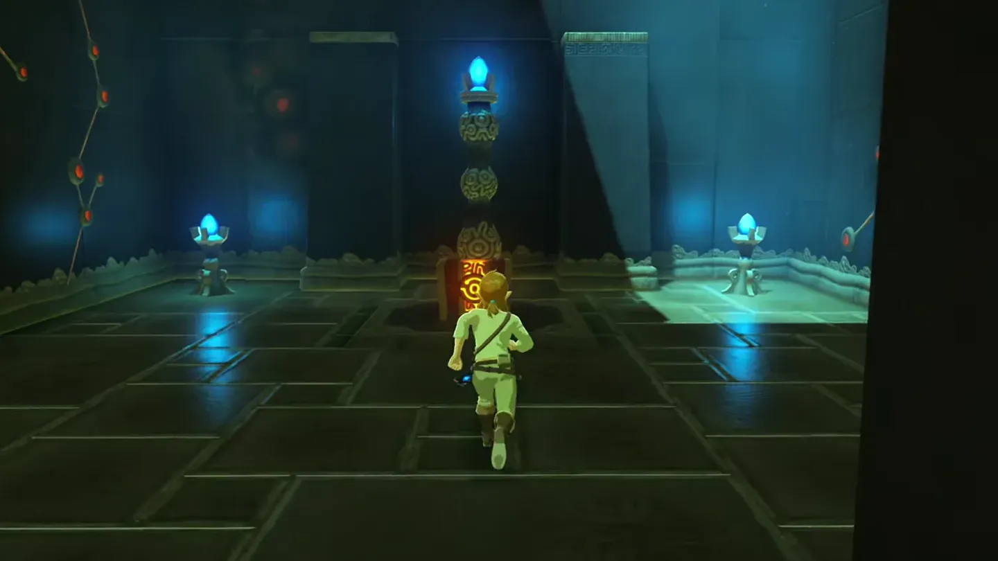 Link running toward a chest in the drained room one