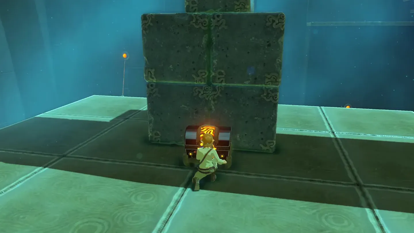 Link opening the chest at the foot of the stone stack