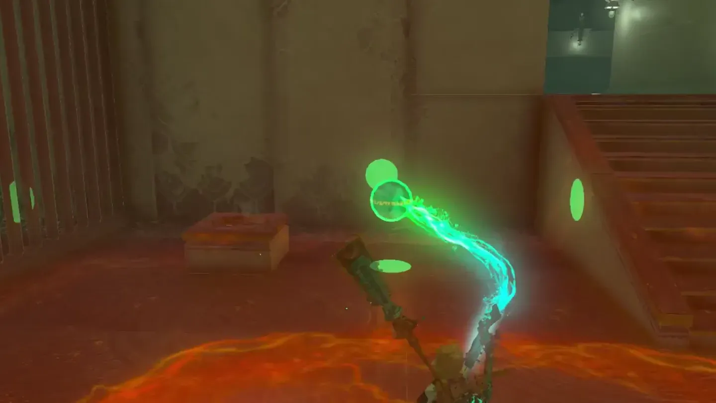 Ultrahand carrying the stone sphere from the right toward the hidden pit