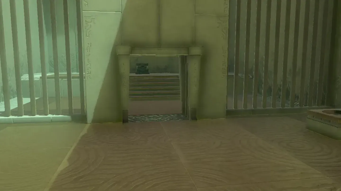 The side gate open with the chest behind its bars