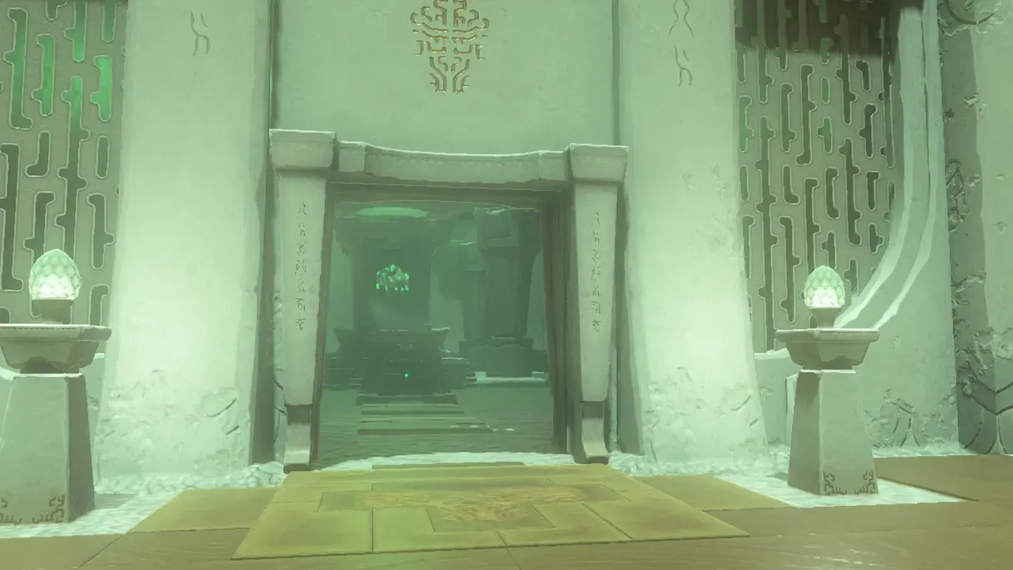 The gate ahead standing open between two lanterns