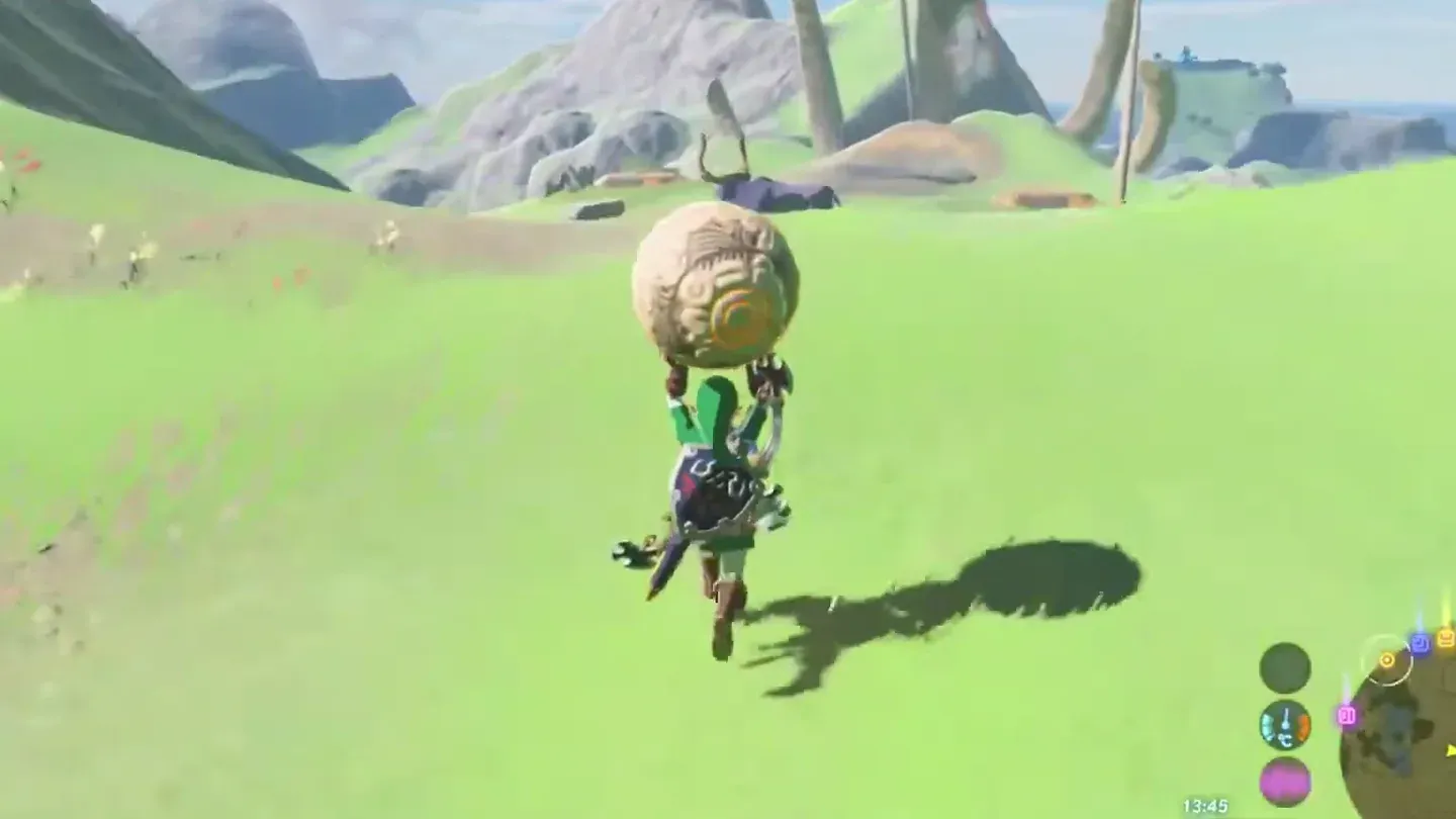 Link carrying the Black Hinox's orb across a field