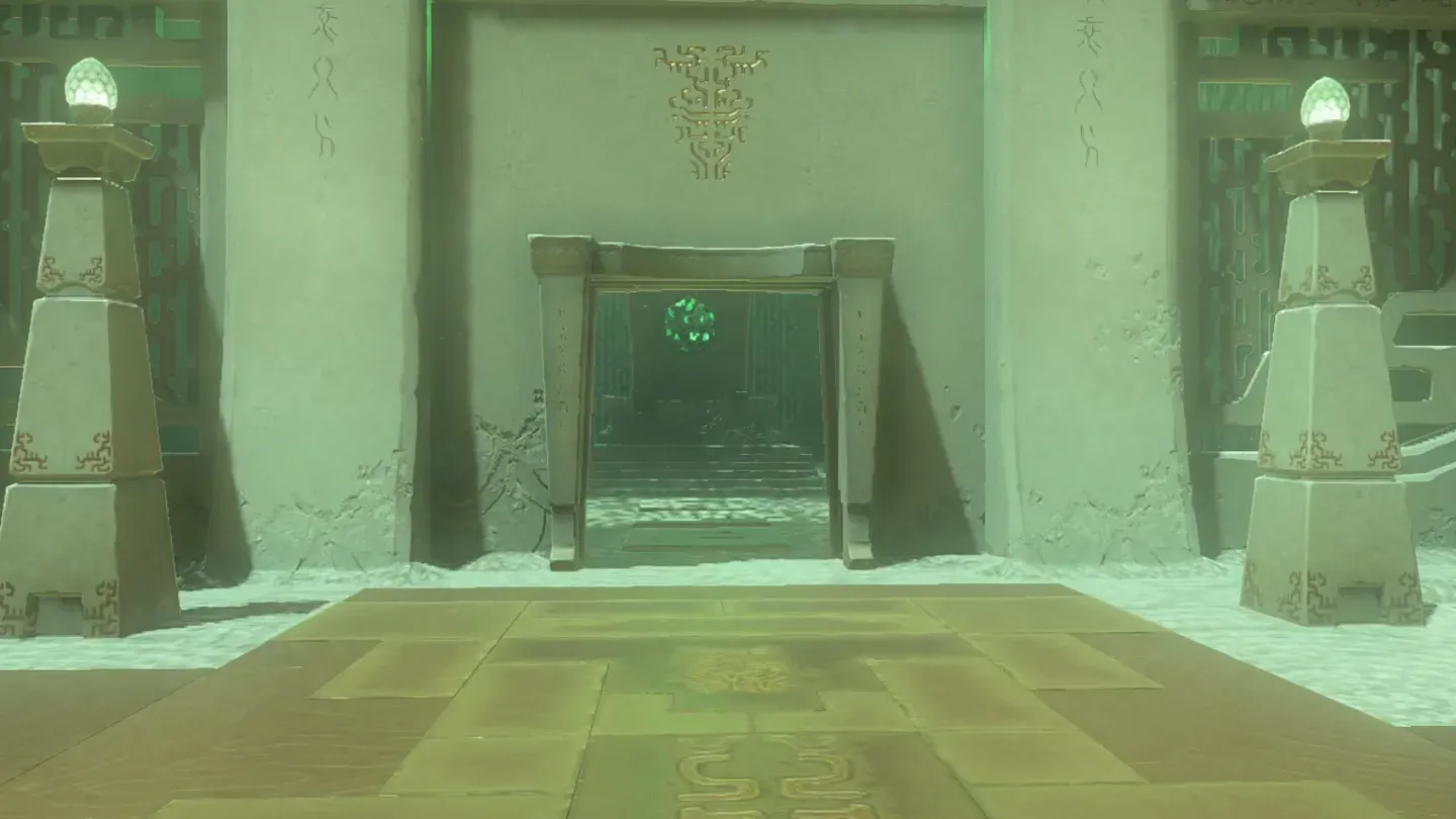 The final gate standing open between two lanterns