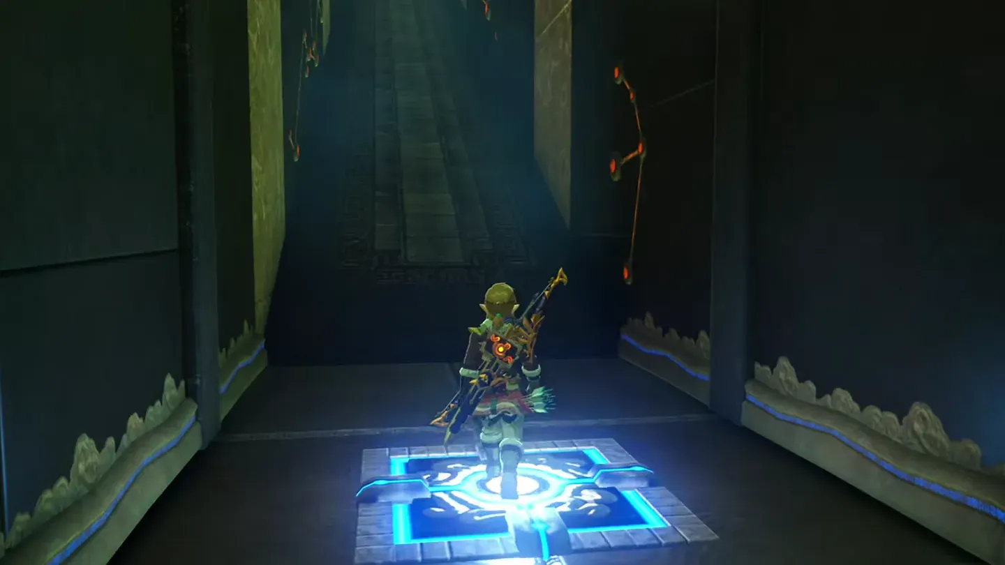 Link standing on the final glowing floor switch at the foot of a ramp