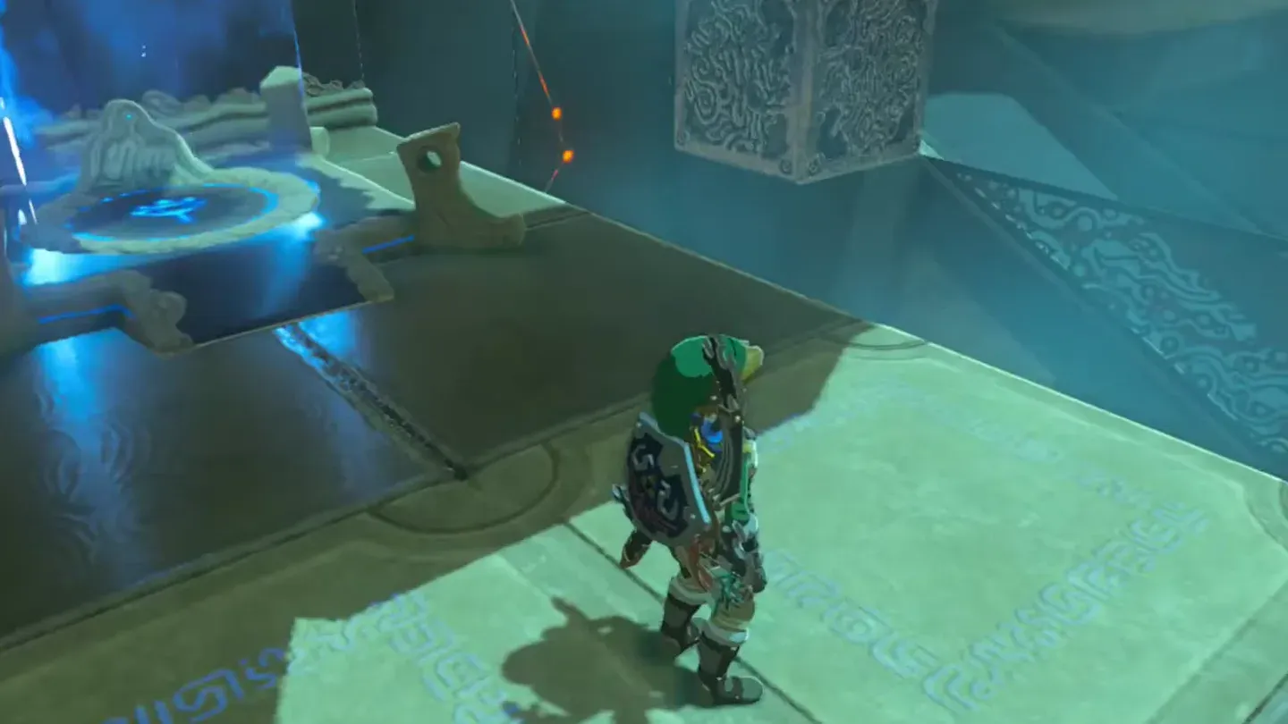 The slot glowing blue as Link stands on the tilted platform