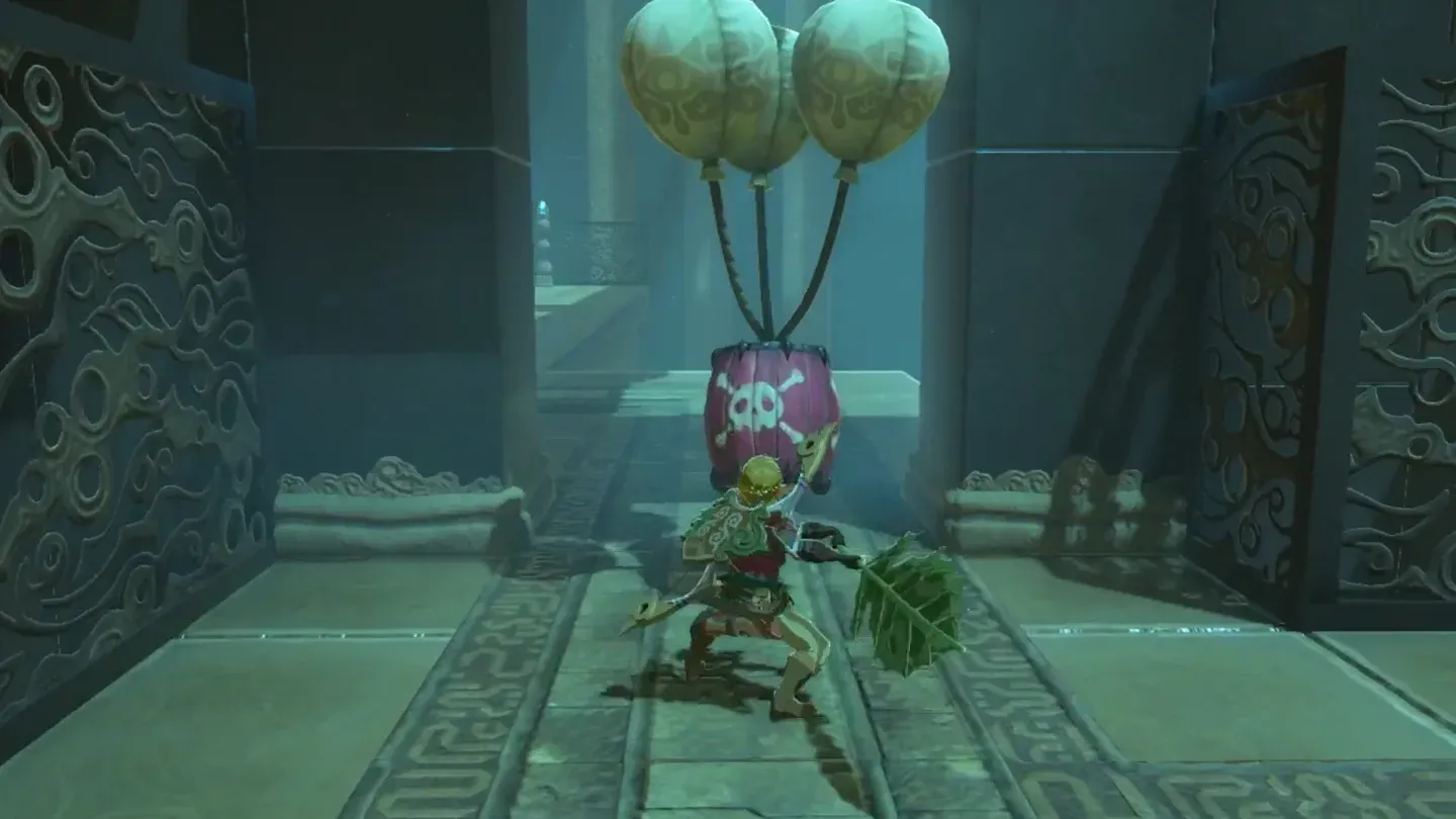 A Bomb Barrel with a skull emblem hanging from two balloons