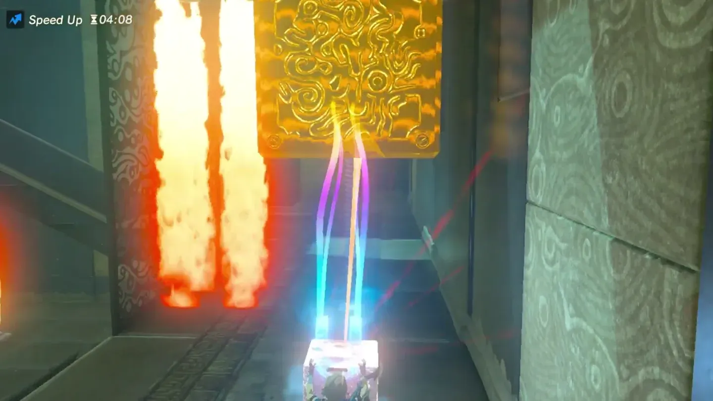 The metal cube held up against the vertical fire jets