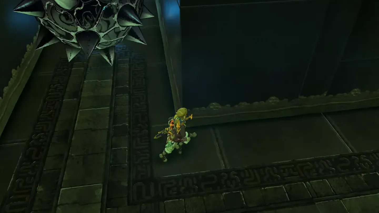 A spiked iron ball rolling down the ramp toward Link