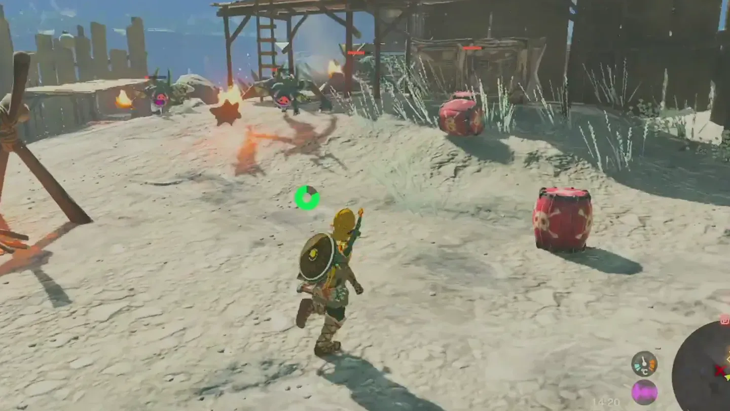 A Bokoblin camp with a wooden frame over a campfire and red explosive barrels
