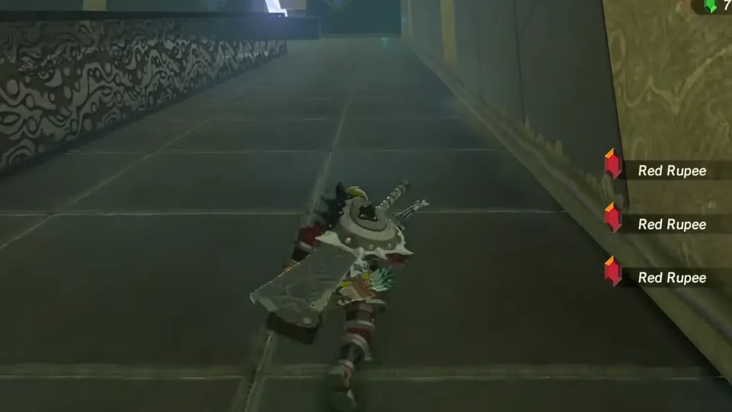Link picking up red rupees at the bottom of the slope