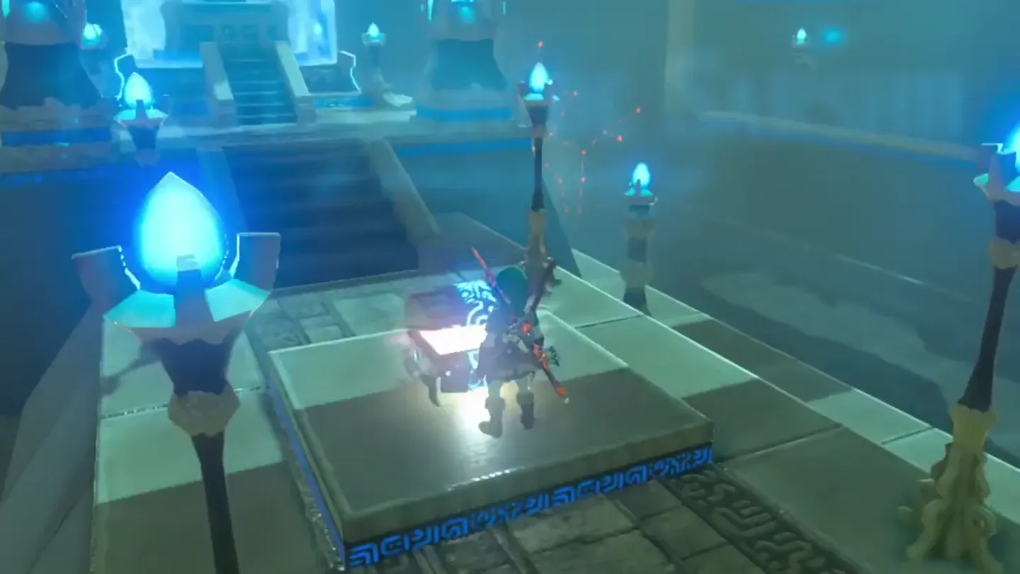 Link opening a treasure chest on a raised platform inside the shrine