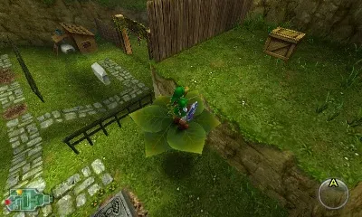 Adult Link rides a large green leaf above the graveyard fence toward a grassy ledge with a wooden crate