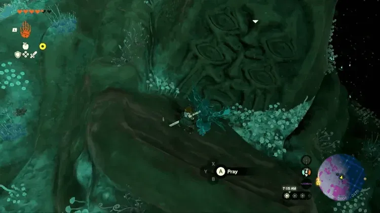 Link praying at a large Bargainer Statue carved into a rock face in the Depths