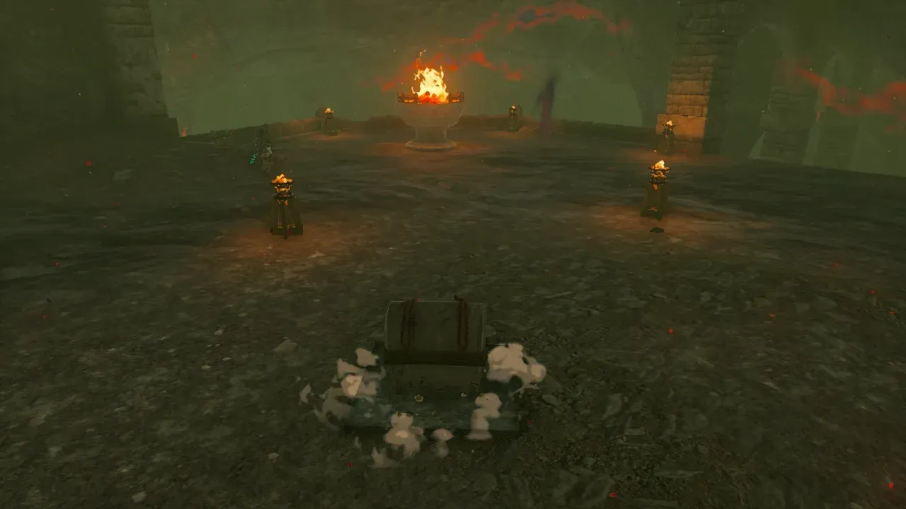 The large brazier burning, with a treasure chest appearing on the floor in front of it