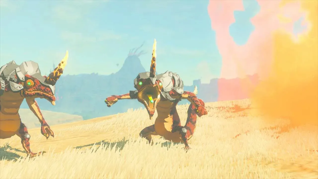 Two red Fire-Breath Lizalfos in a dry grass field