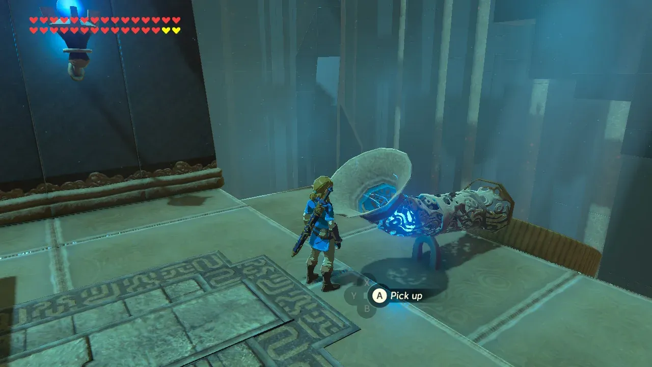 Link standing beside the funnel used to launch a round bomb