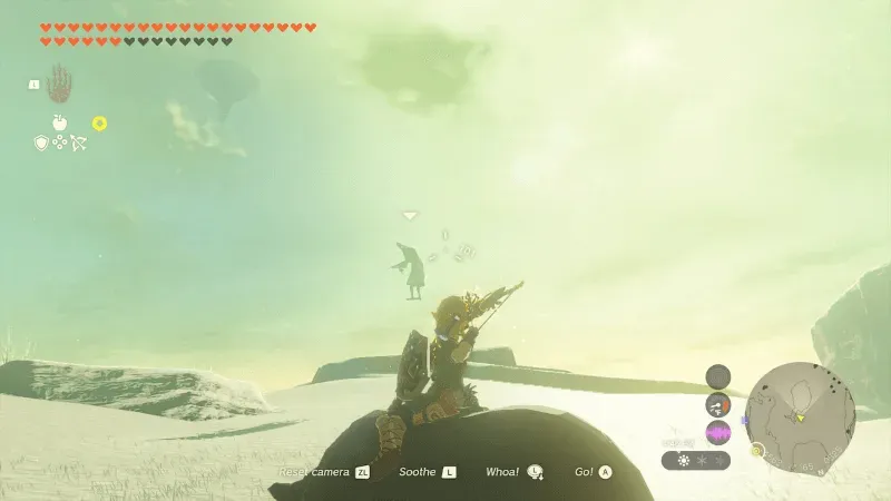 Link on horseback in a snowfield, drawing a bow at a Wizzrobe floating in the sky
