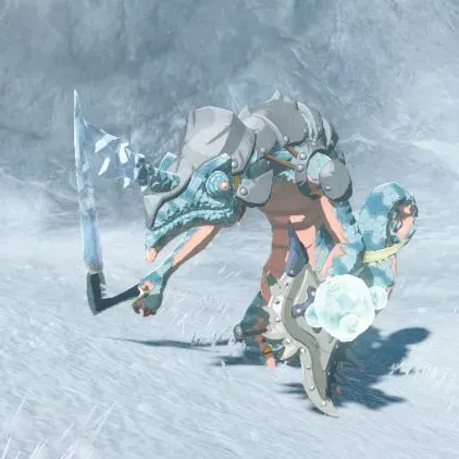 A pale blue Ice-Breath Lizalfos with a crystal horn holding a snowball on a snowfield