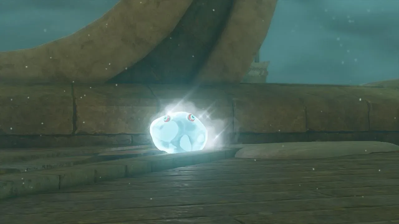 An Ice Chuchu giving off a cold white mist on a stone ledge in falling snow