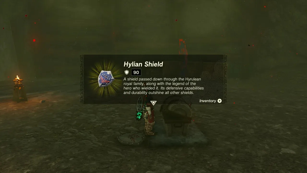 Item card for the Hylian Shield showing guard 90, next to the opened chest