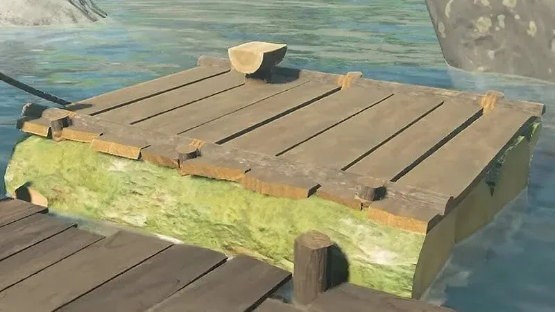 The raft tied beside the river dock near Wetland Stable