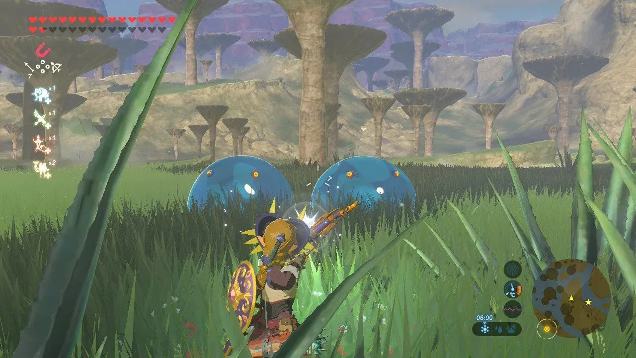 Two large blue Chuchus in tall grass facing Link