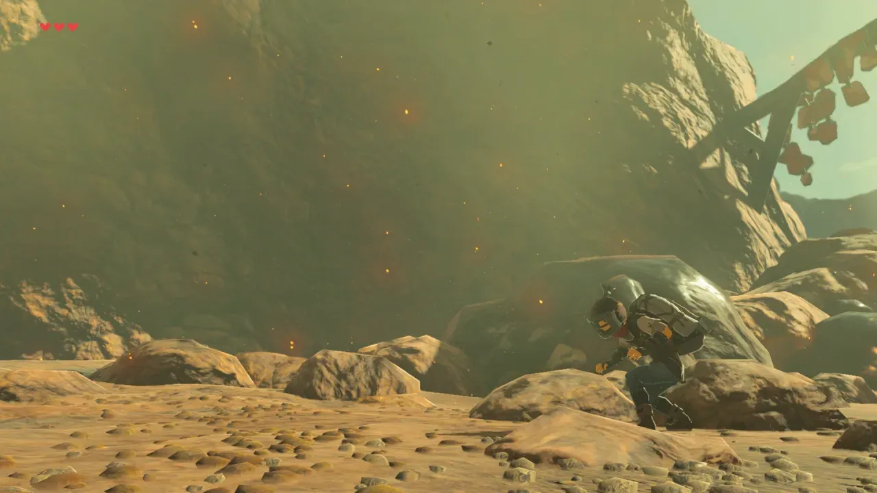 Link crouching on rocky ground in the Fireproof Lizard Roundup side quest