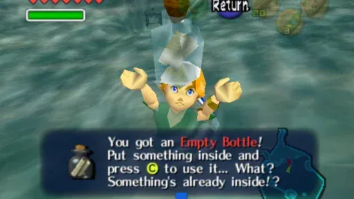 Young Link holds up a bottle with a note inside underwater in Lake Hylia, above the message You got an Empty Bottle, something's already inside
