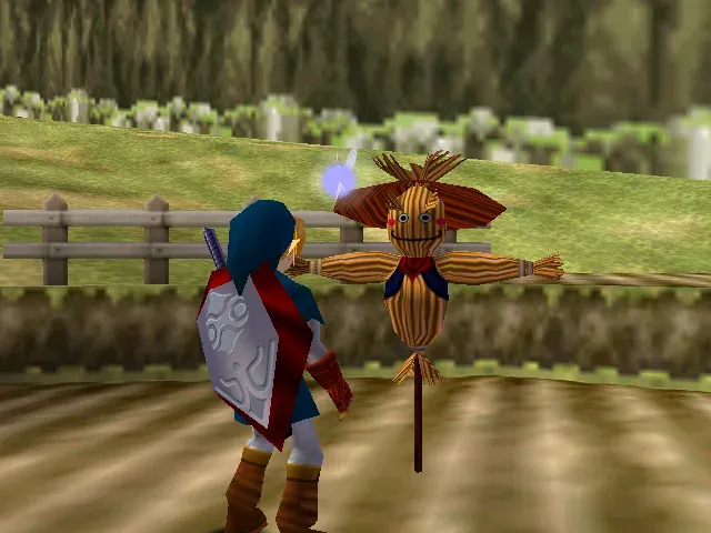 Adult Link in the Zora Tunic stands in front of the scarecrow Bonooru in the fenced plot at Lake Hylia